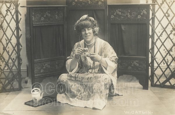 Will Catlin in drag Japenese woman with tea