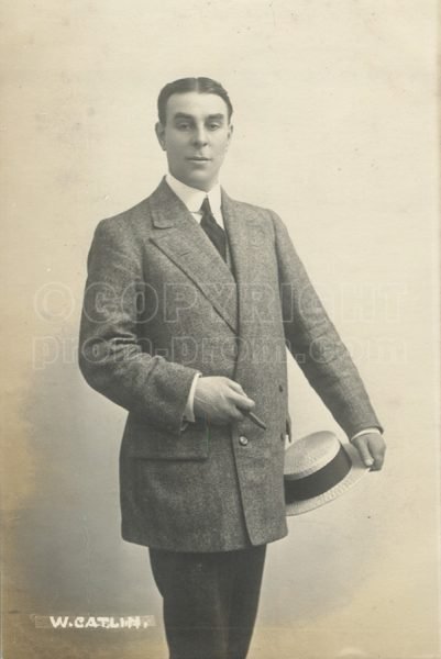 Will Catlin standing posed with straw-boater