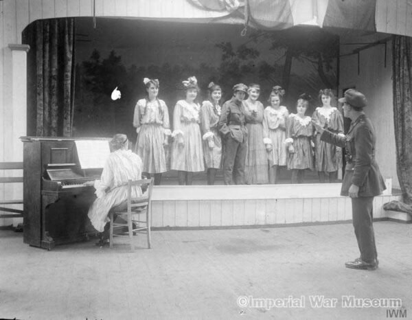 Concert party organised by women carpenters at the Tarrant Hut Works near Calais, 3 December 1918, to give performances to wounded soldiers. - IWM archives