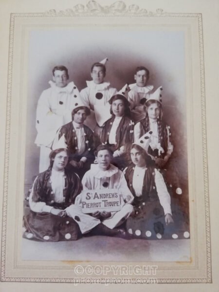 Amateur pierrot troupe, holding sign "St. Andrew's Pierrot Troupe"