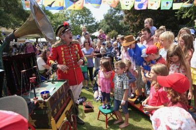 Uncle-Tacko-Flea-Circus-outdoors-with-crowd-and-bunting